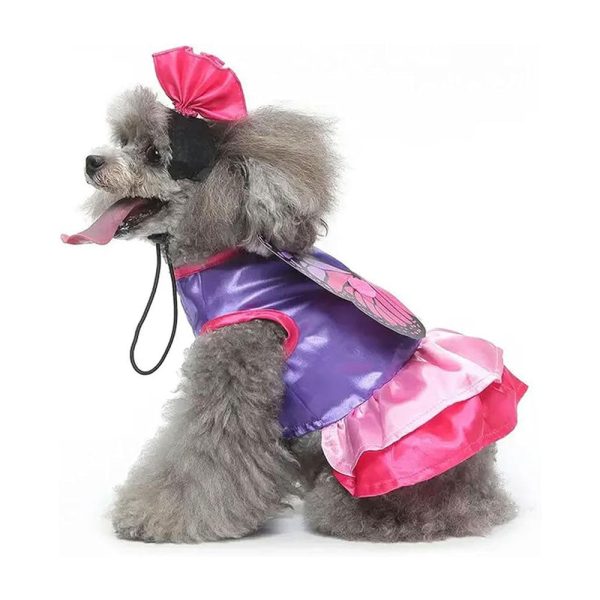 Side view of dog in butterfly costume showing layered wing design and secure fit