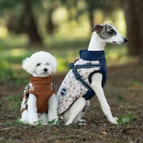 Waterproof dog puffer coat with built-in harness and fleece lining, perfect for keeping small dogs warm and dry.