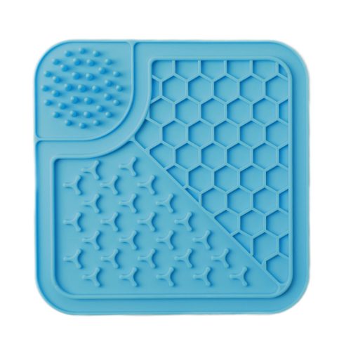 Blue silicone dog lick mat ideal for calming dogs, slowing eating, and aiding digestion, with a non-slip design for easy use.