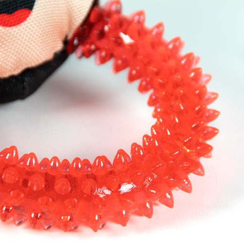 Close-up of the red textured teething ring on the Minnie Mouse dog toy, highlighting the durable material and chew-friendly design.