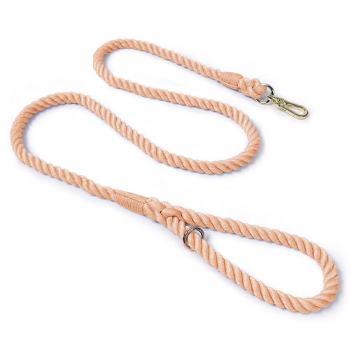 Peach-toned cotton rope dog lead in a gentle, neutral shade, laid flat to highlight its natural, minimalist style.