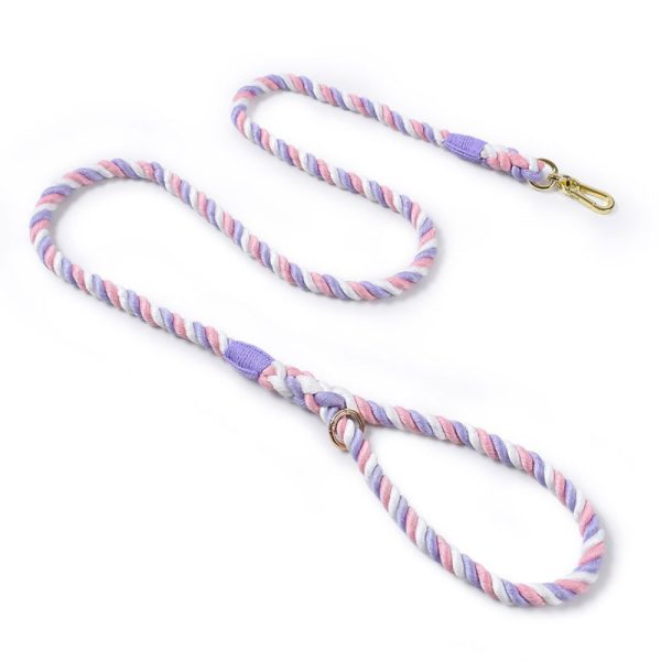 Twisted rope dog lead in pastel purple, pink, and white with a soft, whimsical look, shown coiled for detail.
