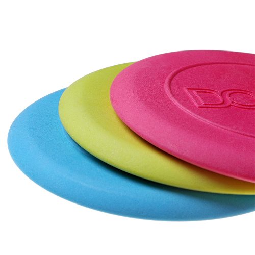 A trio of DOOG Dog Frisbees in yellow, blue, and pink, designed for safe, high-energy fetch and water play.