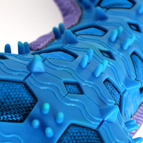 Detailed close-up of the Stitch Bone Dog Toy’s textured TPR surface, highlighting durable material and gentle ridges for teeth and gums
