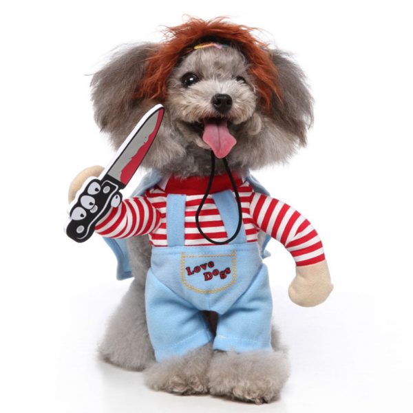 Small dog wearing Chucky Dog Costume with toy knife hands and striped shirt for Halloween.