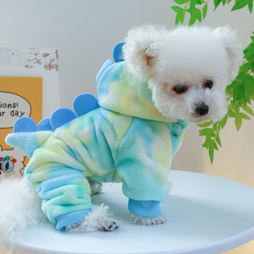 Side view of small dog wearing Dinosaur Dog Hoodie in blue, green, and yellow with hood visible.